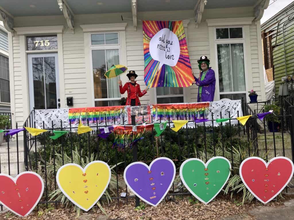 Our Mardi Gras 2023 house with an All You Need is Love Beatles theme with a banner, large hearts and musical notes, which led to a break in our regularly scheduled Black History Month author recs