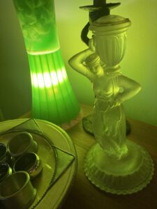 lava lamp casts green light on a statue of a woman shouldering an urn illustrating the right to serve on juries