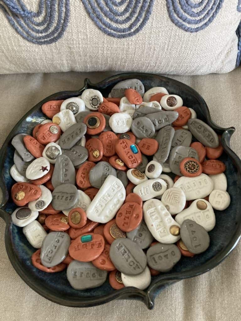 A bowl of adobe, white, and grey small round Thumb Prayers for the Vicksburg Massacres Remembrance