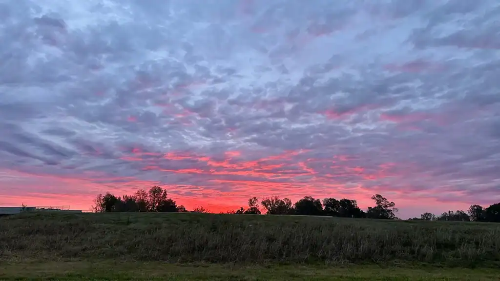A blood red sunrise over Vicksburg National Military Park the morning of the 150th Commemoration of the Vicksburg Massacres when I acquired the name Granddaughter of the Instigator