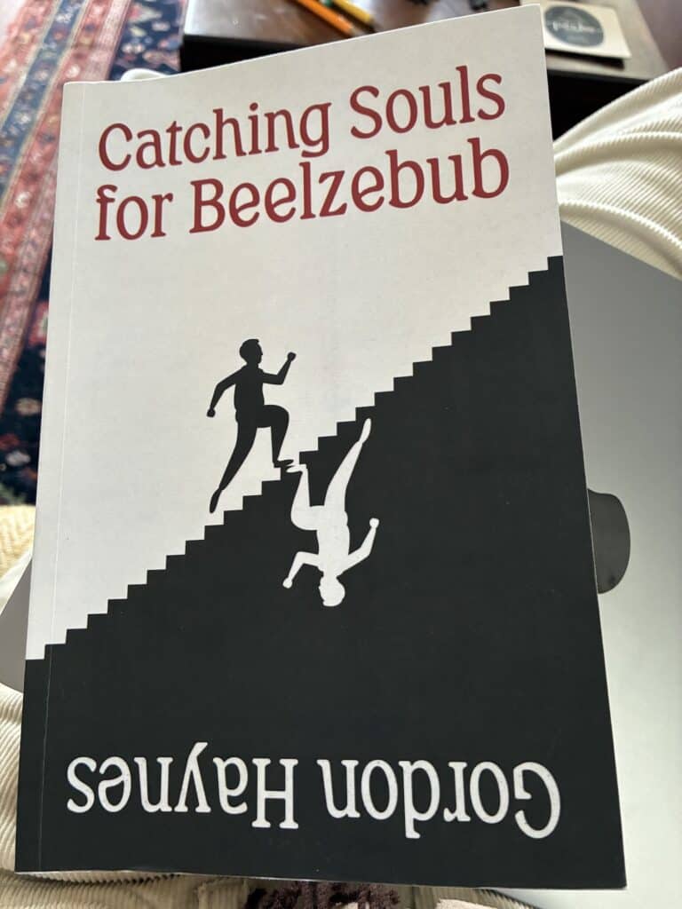 Balck and white cover of Catching Souls for Beelzebub featuring a staircase with a man running up and, on the flip side, a man running down